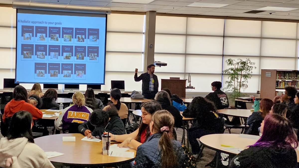 Goals coach Dr. John Hirano speaking to a classroom full of students.