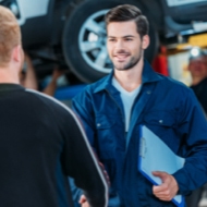 Two men talking in garage