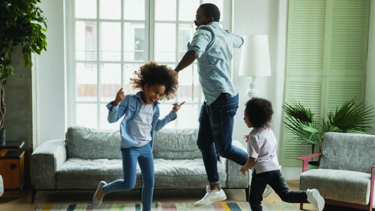 Family playing in living room